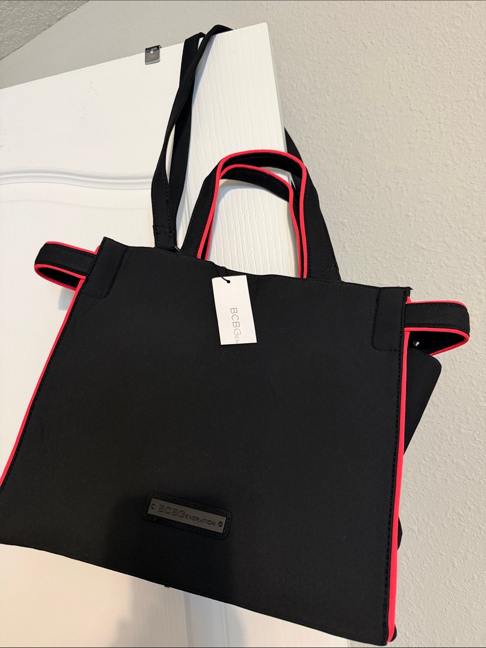 New BCBGeneration Black Tote with Pink Piping.